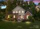 Charming two-story home with brick and stucco, manicured landscaping, and mature trees in a desirable neighborhood at 322 Oakview Dr, Salisbury, NC 28146