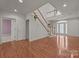 Open foyer with hardwood floors, stairs to the second level, and a glass front door at 322 Oakview Dr, Salisbury, NC 28146