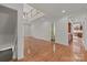 Foyer with hardwood flooring, stairs, and neutral wall color at 322 Oakview Dr, Salisbury, NC 28146