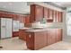 Spacious kitchen with wood cabinets, white countertops, and modern appliances offers ample storage and cooking space at 322 Oakview Dr, Salisbury, NC 28146