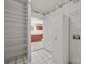 Bright laundry room with storage cabinets, shelving, and access to the kitchen at 322 Oakview Dr, Salisbury, NC 28146
