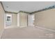 Spacious main bedroom featuring ensuite bathroom, carpet, and neutral colored walls at 322 Oakview Dr, Salisbury, NC 28146