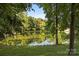 Scenic view of a tranquil pond with trees reflecting in the water, creating a serene natural setting at 322 Oakview Dr, Salisbury, NC 28146