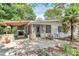 Backyard with fireplace, outdoor kitchen, covered patio, and a well-maintained lawn at 3311 Camden Rd, Marshville, NC 28103