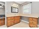 Bathroom vanity with light beige countertop, wooden drawers and cabinet doors, and a window for natural light at 3311 Camden Rd, Marshville, NC 28103