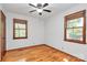 Bright bedroom featuring hardwood floors, and two windows providing natural light at 3311 Camden Rd, Marshville, NC 28103