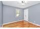 Neutral bedroom with hardwood floors, a ceiling fan and window with natural light at 3311 Camden Rd, Marshville, NC 28103