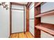 Walk-in closet featuring hardwood floors, shelving and a hanging rod at 3311 Camden Rd, Marshville, NC 28103