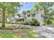 Charming two-story home featuring a lush front yard, driveway, and attached garage at 3311 Camden Rd, Marshville, NC 28103