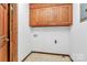 Spacious laundry room featuring wall cabinets, tile flooring and ample wall space at 3311 Camden Rd, Marshville, NC 28103