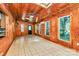 Spacious room with wood paneling, tiled floor, and large windows offering lots of light at 3311 Camden Rd, Marshville, NC 28103