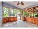 Inviting screened porch with wood paneling, tiled floor, and views of the outdoors at 3311 Camden Rd, Marshville, NC 28103