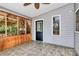 Enclosed porch featuring tile flooring, wood walls and screened windows for natural light at 3311 Camden Rd, Marshville, NC 28103
