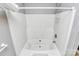 A clean white tub and shower combo with a convenient caddy for shower essentials at 3311 Camden Rd, Marshville, NC 28103