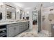 Bathroom featuring dual sinks, marble countertops, and access to walk-in shower at 3717 Bounty Ct, Matthews, NC 28104