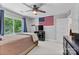 Cozy bedroom with a wooden ceiling fan, large window, and American flag decor at 3717 Bounty Ct, Matthews, NC 28104