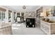 Bright office space with a desk, shelving, three windows, and a comfortable armchair at 3717 Bounty Ct, Matthews, NC 28104