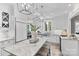 Bright kitchen features marble countertops, stainless steel appliances, and decorative pendant lighting at 3717 Bounty Ct, Matthews, NC 28104