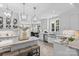 Bright kitchen features white cabinetry, marble countertops, stainless steel appliances, and pendant lighting at 3717 Bounty Ct, Matthews, NC 28104