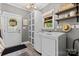 Functional laundry room featuring modern washer and dryer, ample storage, and stylish decor at 3717 Bounty Ct, Matthews, NC 28104
