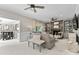 Inviting living room with a stone fireplace, built-in shelves and neutral colored seating at 3717 Bounty Ct, Matthews, NC 28104