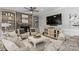 Comfortable living room featuring a stone fireplace, built-in shelving, and stylish furnishings at 3717 Bounty Ct, Matthews, NC 28104