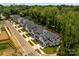 Stunning aerial view of a new construction community with modern homes, manicured lawns and tree-lined streets at 3953 Plainview Rd, Charlotte, NC 28208