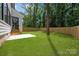 Expansive backyard features a patio and wooden privacy fence, perfect for outdoor enjoyment at 3953 Plainview Rd, Charlotte, NC 28208