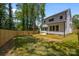Spacious backyard features a patio and wooden privacy fence, offering privacy and space to enjoy at 3953 Plainview Rd, Charlotte, NC 28208