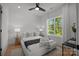 Bright bedroom features a comfortable bed, natural light, and minimal decor at 3953 Plainview Rd, Charlotte, NC 28208