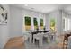 Bright dining room with large windows, modern furniture, and contemporary decor at 3953 Plainview Rd, Charlotte, NC 28208