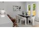 Bright dining room, featuring large windows and modern chairs at 3953 Plainview Rd, Charlotte, NC 28208