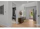 Hallway with hardwood floors, access to an office and view of front entrance at 3953 Plainview Rd, Charlotte, NC 28208