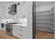 Elegant kitchen featuring stainless steel appliances, custom cabinets, and a walk-in pantry at 3953 Plainview Rd, Charlotte, NC 28208
