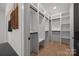 Walk-in closet with custom organizers and ample shelving for efficient storage solutions in the home at 3953 Plainview Rd, Charlotte, NC 28208