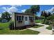 Charming outbuilding features a quaint design with window boxes and lush landscaping in a well-maintained lawn at 402 Walnut St # 11, China Grove, NC 28023