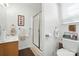 Bathroom features vanity, toilet, and shower with glass door at 402 Walnut St, China Grove, NC 28023