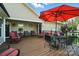 The deck is furnished with comfortable seating and an umbrella-covered table, creating a relaxing space at 402 Walnut St, China Grove, NC 28023