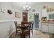 Charming dining area with a round table, chairs, and access to the outdoor space at 402 Walnut St, China Grove, NC 28023