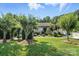Charming home surrounded by lush greenery, showcasing a well-manicured lawn and mature trees at 402 Walnut St, China Grove, NC 28023