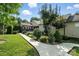 Well-maintained home with a walkway to the deck, surrounded by mature landscaping and manicured lawn at 402 Walnut St, China Grove, NC 28023