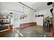 Spacious garage with epoxy floors, brick accent walls, painted trim and work bench at 402 Walnut St, China Grove, NC 28023