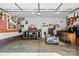 Spacious garage featuring ample storage, a seating area, and a variety of tools and equipment for hobbies at 402 Walnut St, China Grove, NC 28023