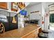 Garage bar area features seating, counter space, refrigerator, television and plenty of storage at 402 Walnut St, China Grove, NC 28023