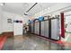 Clean garage with epoxy floors, large storage cabinets, ample storage space, and garage door at 402 Walnut St, China Grove, NC 28023