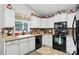 Functional kitchen with granite countertops, modern appliances, and ample cabinet space at 402 Walnut St, China Grove, NC 28023