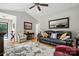 Bright living room with hardwood floors, a ceiling fan, and comfortable furniture at 402 Walnut St, China Grove, NC 28023