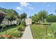 Backyard shed with charming details, set amidst beautiful landscaping, offering extra storage space at 402 Walnut St, China Grove, NC 28023