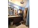 Modest full bathroom with linoleum floors, a shower/tub with curtain, and a vanity with storage at 404 Long Shoals Rd, Bessemer City, NC 28016