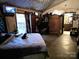 Bedroom featuring a bed, armoires, and a cat sitting atop the comforter at 404 Long Shoals Rd, Bessemer City, NC 28016